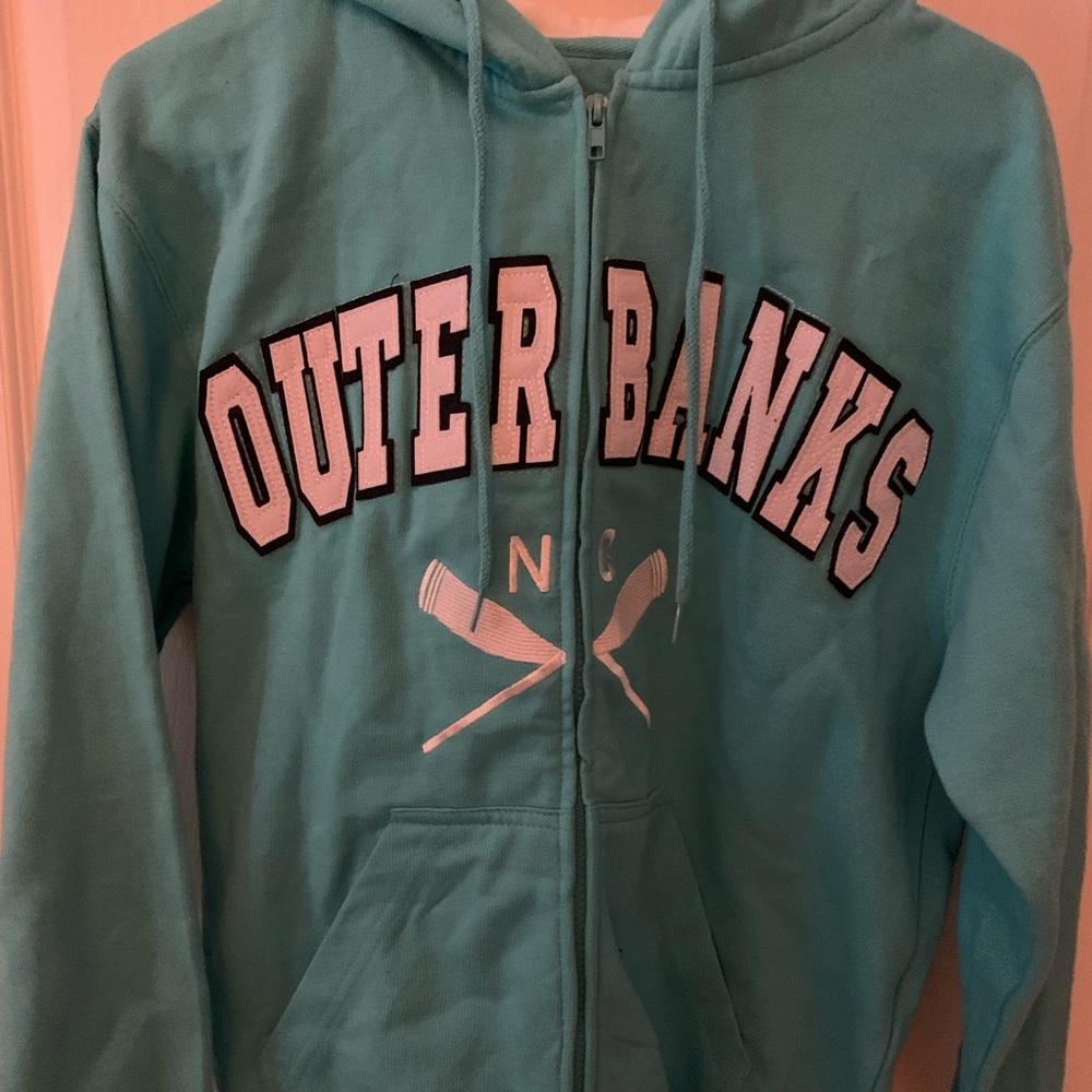 Women’s aqua zip up “Outer Banks” hoodie.